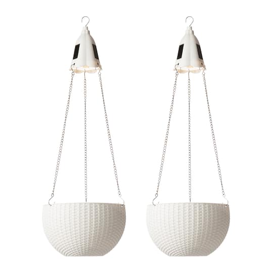 Glitzhome® 30" White Solar Lighted Hanging Plastic Basket Planters, 2ct.